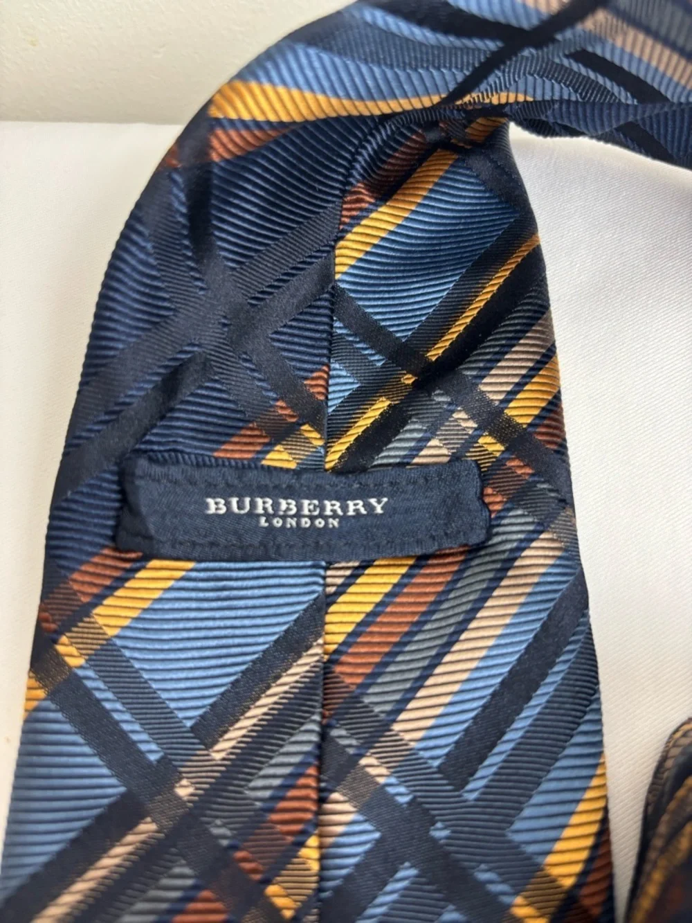 Burberry Silk Tie in Geometric Gold and Navy Blue Pattern